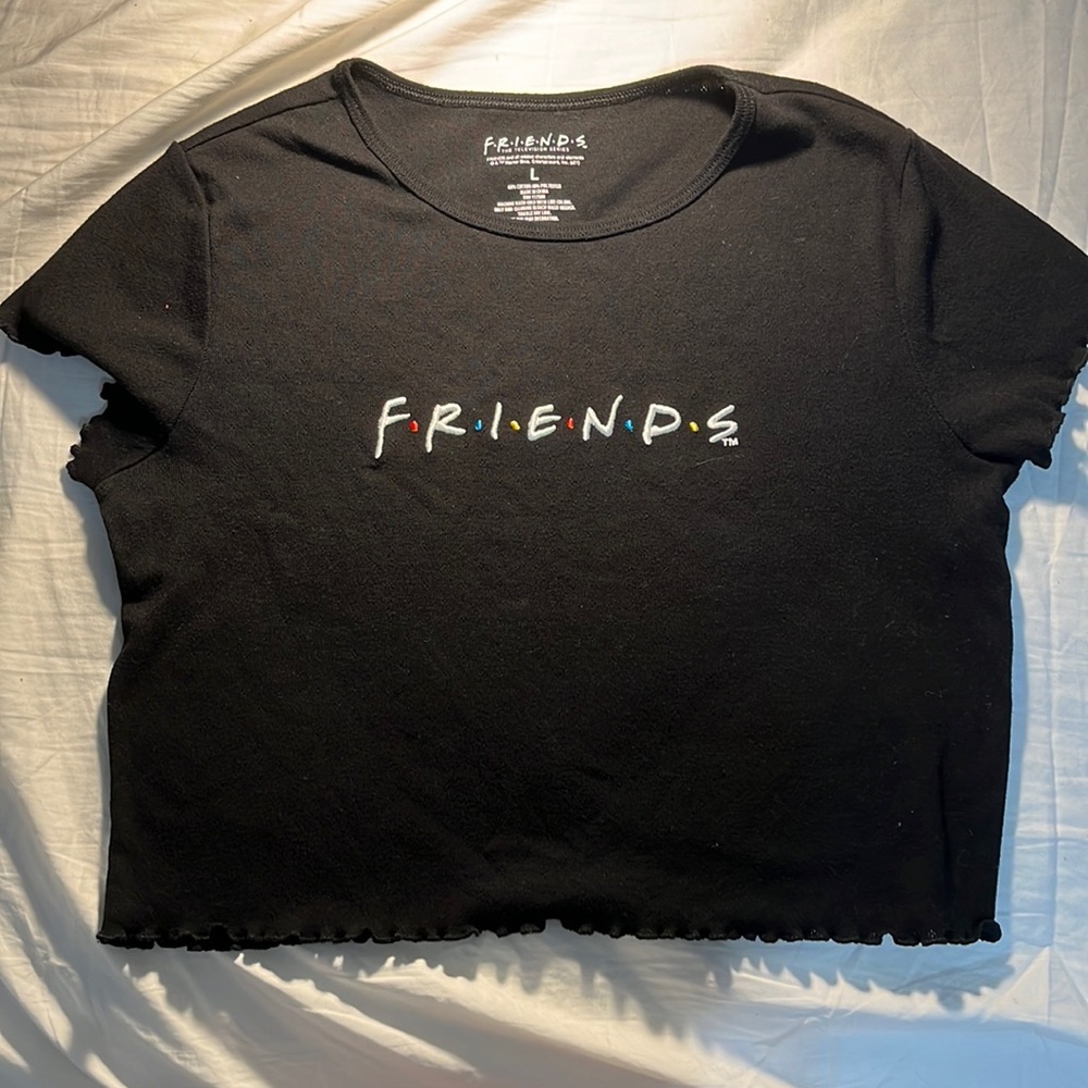 Black FRIENDS shirt from F•R•I•N•D•S tv show. Fits snug to body.